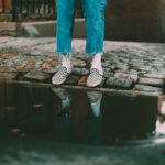 person waering blue jeans